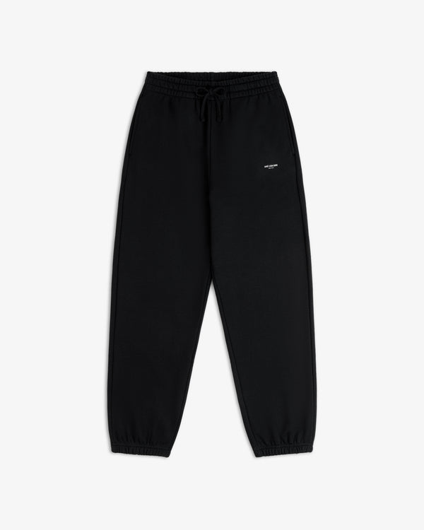 Micro Logo Sweatpants in black with elastic cuffs and a small white logo on the left hip, shown flat on white.