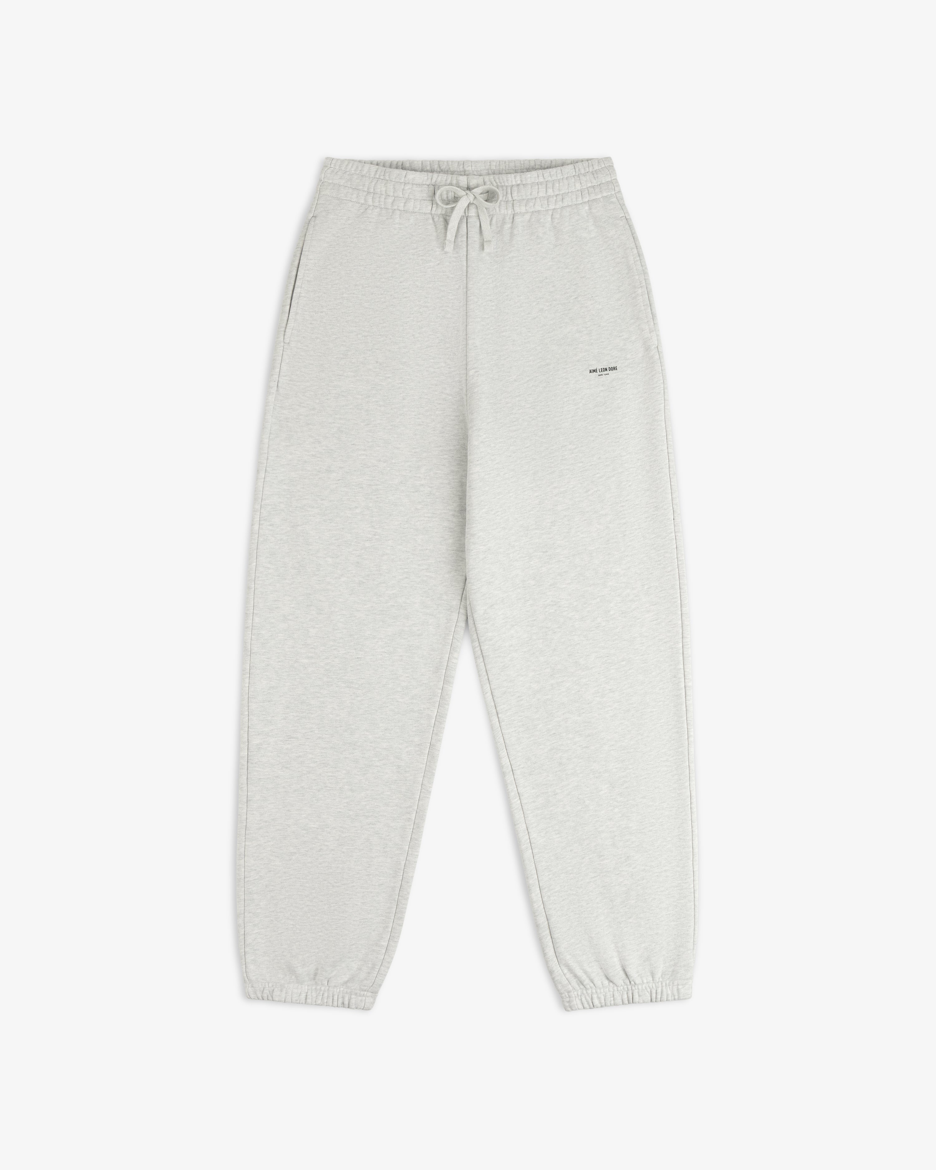 Light gray Micro Logo Sweatpants with drawstring waist, side pockets, and elastic cuffs on white background.