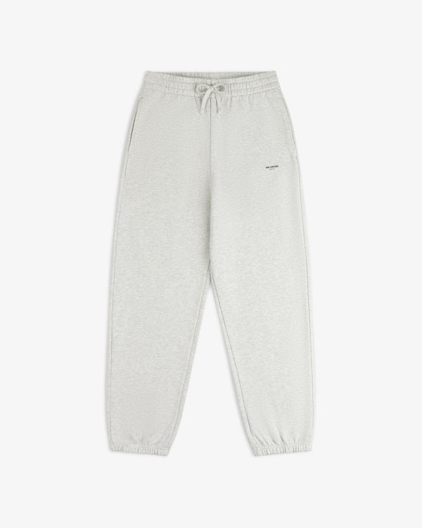 Light gray Micro Logo Sweatpants with drawstring waist, side pockets, and elastic cuffs on white background.
