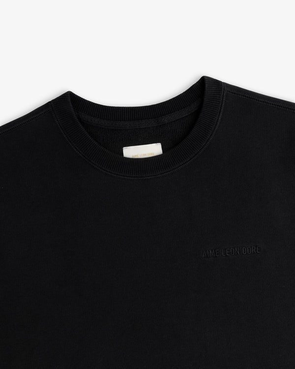 Tonal Logo Crewneck Sweatshirt in black with subtle chest embroidery, shown against a white background.