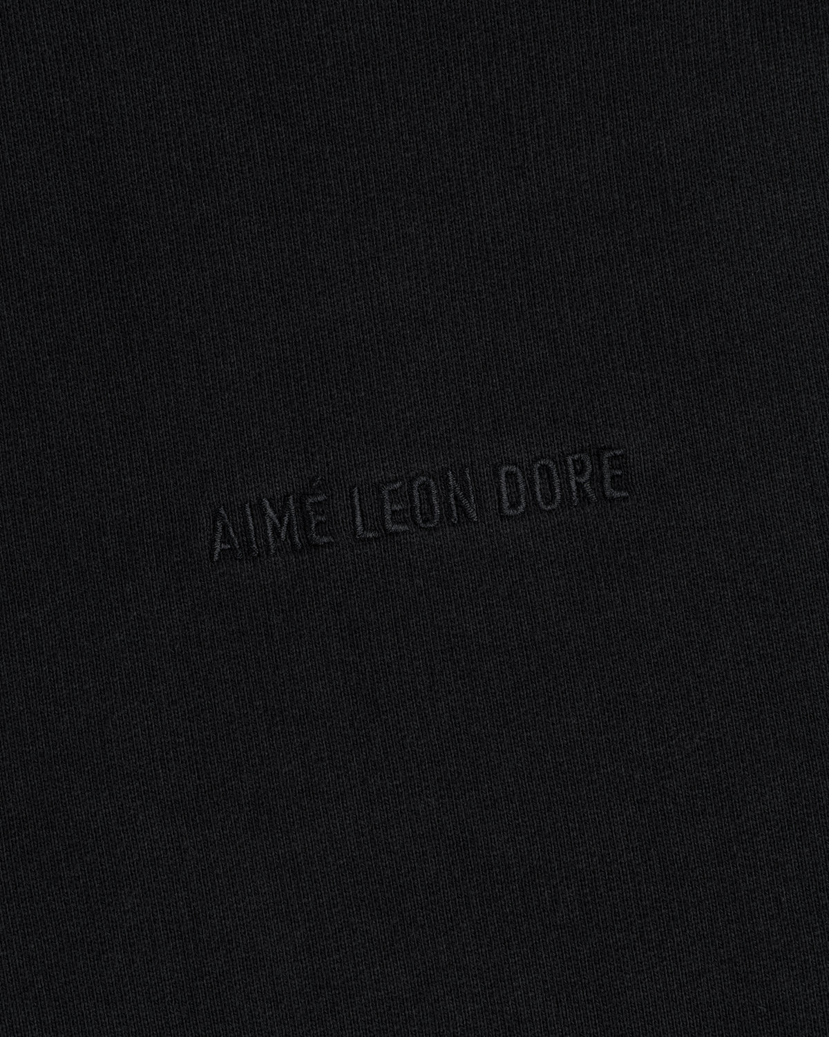 AIME LEON DORE Tonal Logo Crewneck Sweatshirt: black, minimalist design with subtle embossed branding.