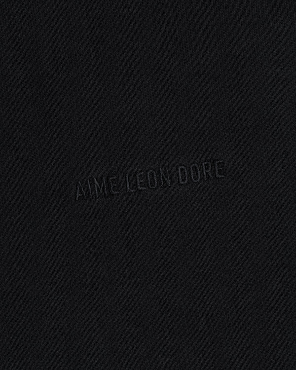 AIME LEON DORE Tonal Logo Crewneck Sweatshirt: black, minimalist design with subtle embossed branding.