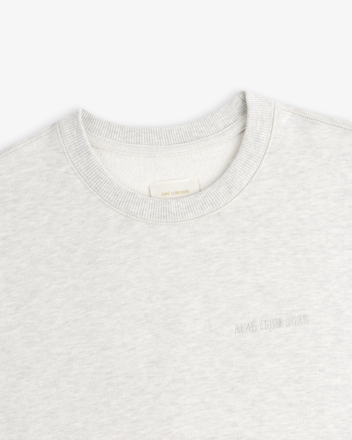 Light grey Tonal Logo Crewneck Sweatshirt with subtle AIMÉ LEON DORE text embroidered on the left chest.