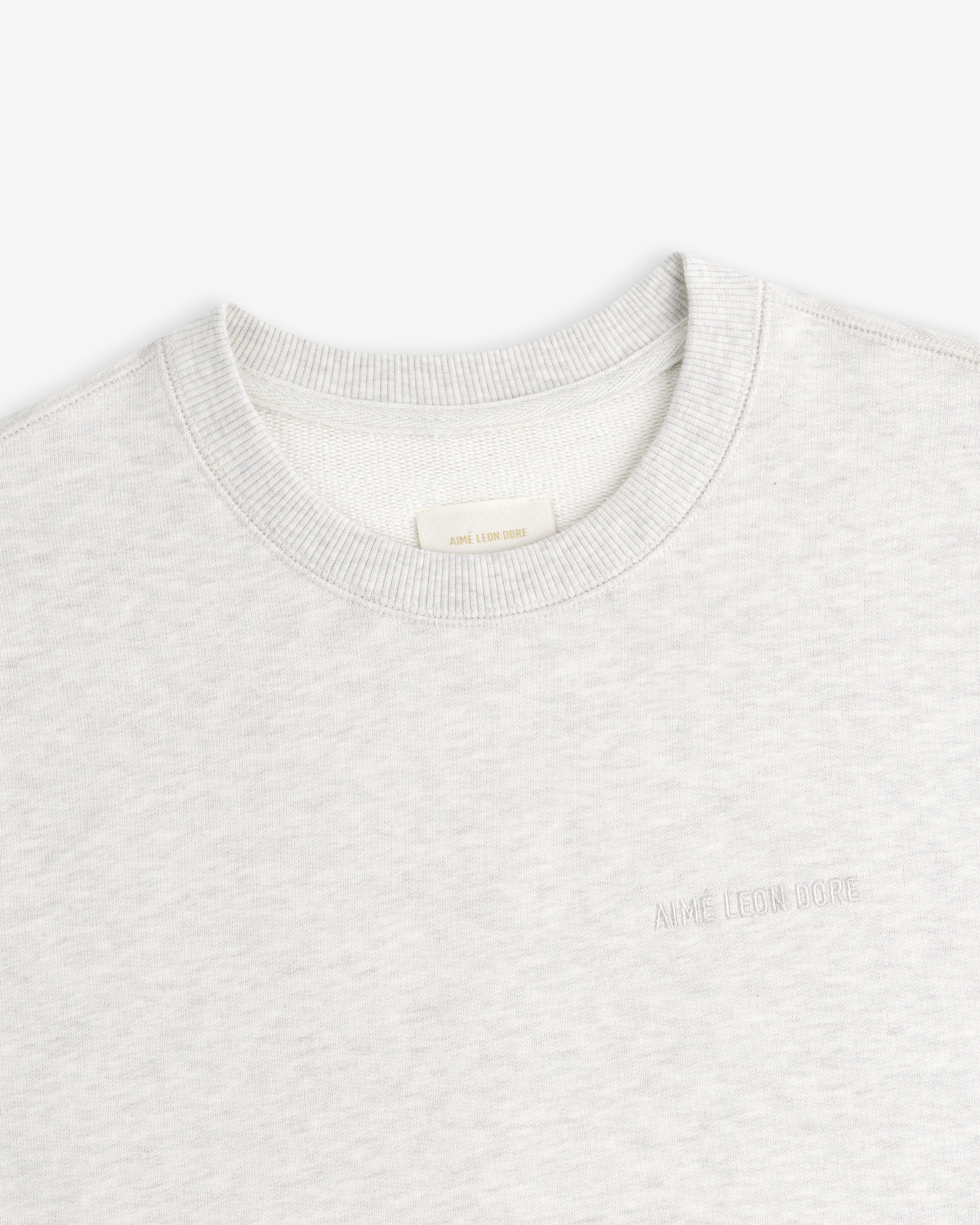 Light grey Tonal Logo Crewneck Sweatshirt with subtle AIMÉ LEON DORE text embroidered on the left chest.