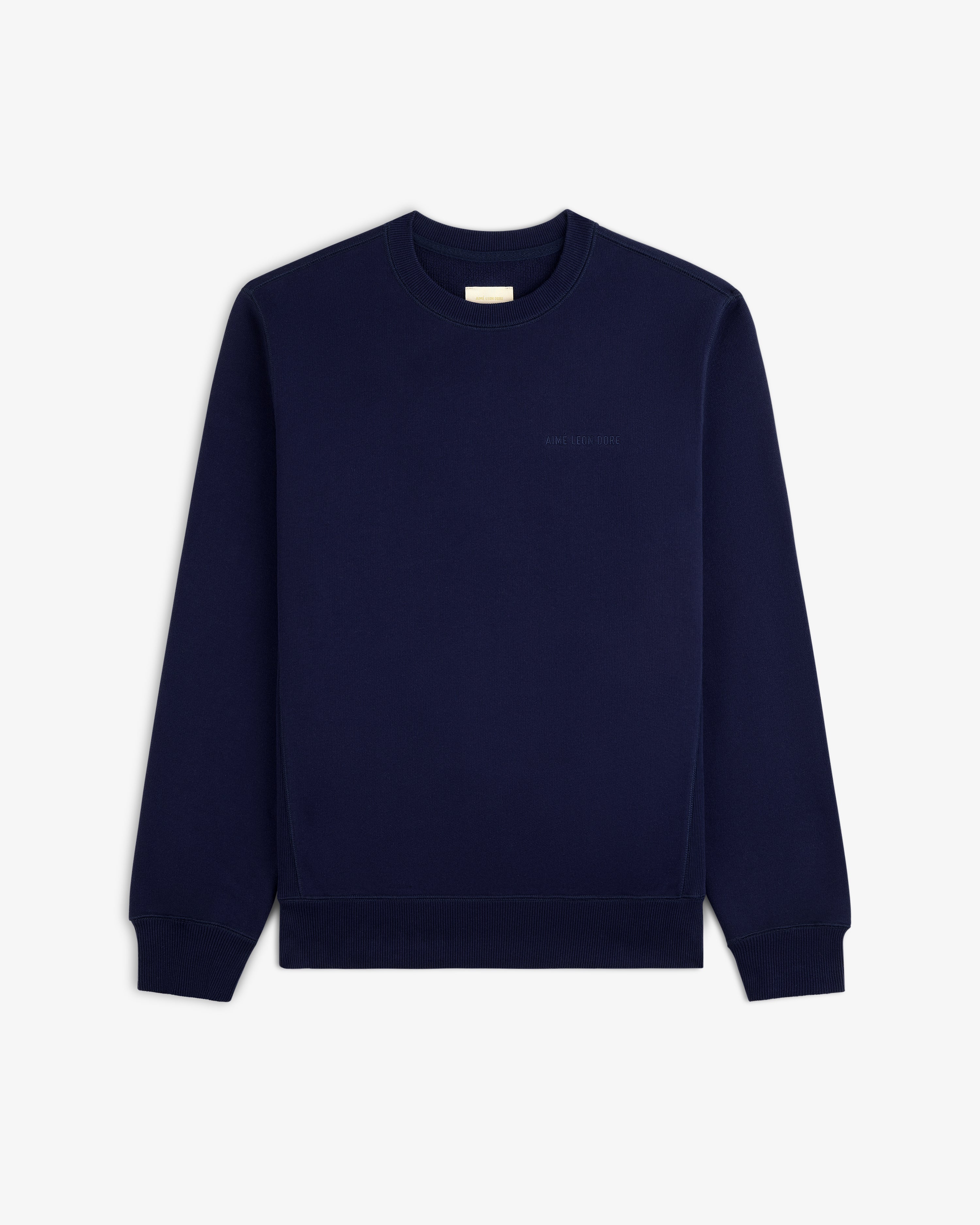 Tonal Logo Crewneck Sweatshirt in navy blue with long sleeves, shown flat on a white background.