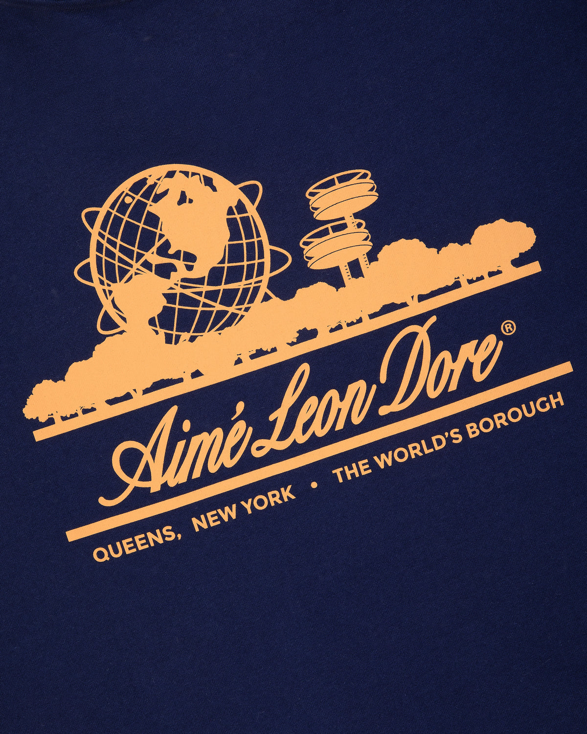 Navy Unisphere Tee with yellow Aimé Leon Dore logo, globe, trees, and Queens icons. Text: “QUEENS, NEW YORK • THE WORLDS BOROUGH”.