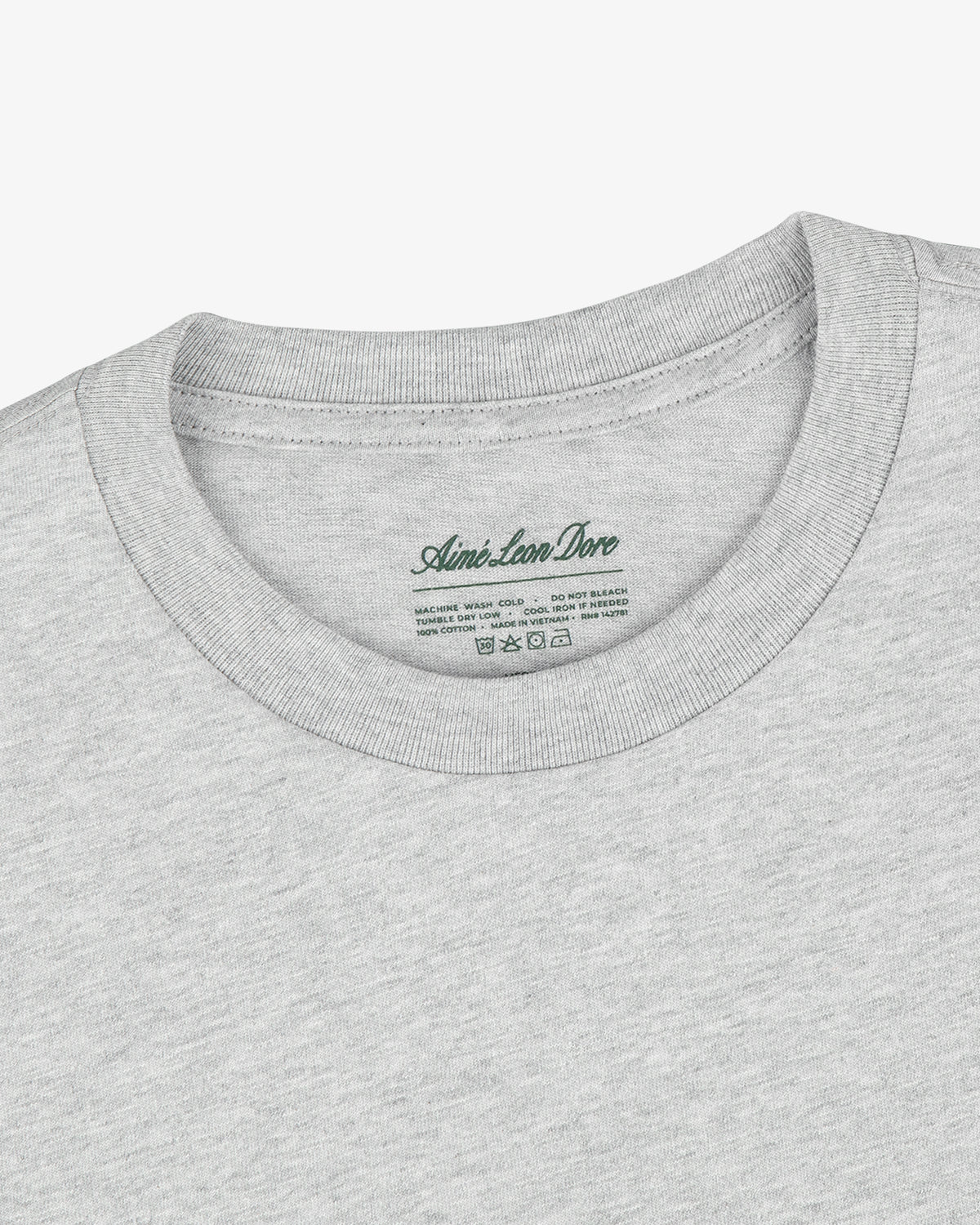 Close-up of a light gray crewneck from the Multi-Color T-Shirt 3-Pack, with logo and care instructions on inner collar.