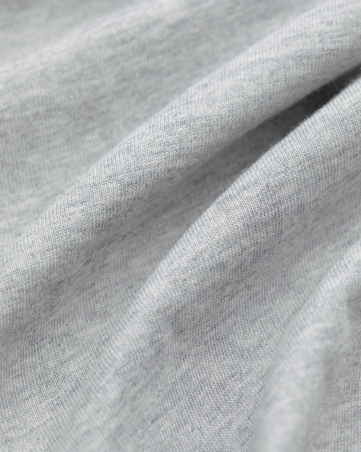 Close-up of Multi-Color T-Shirt 3-Pack in light gray fabric with visible texture and soft folds.