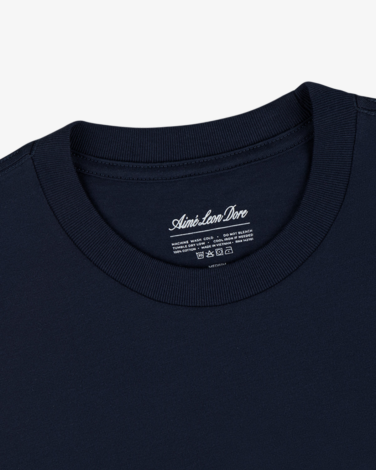 Close-up of a navy blue crew neck from the Multi-Color T-Shirt 3-Pack with branded inside label.