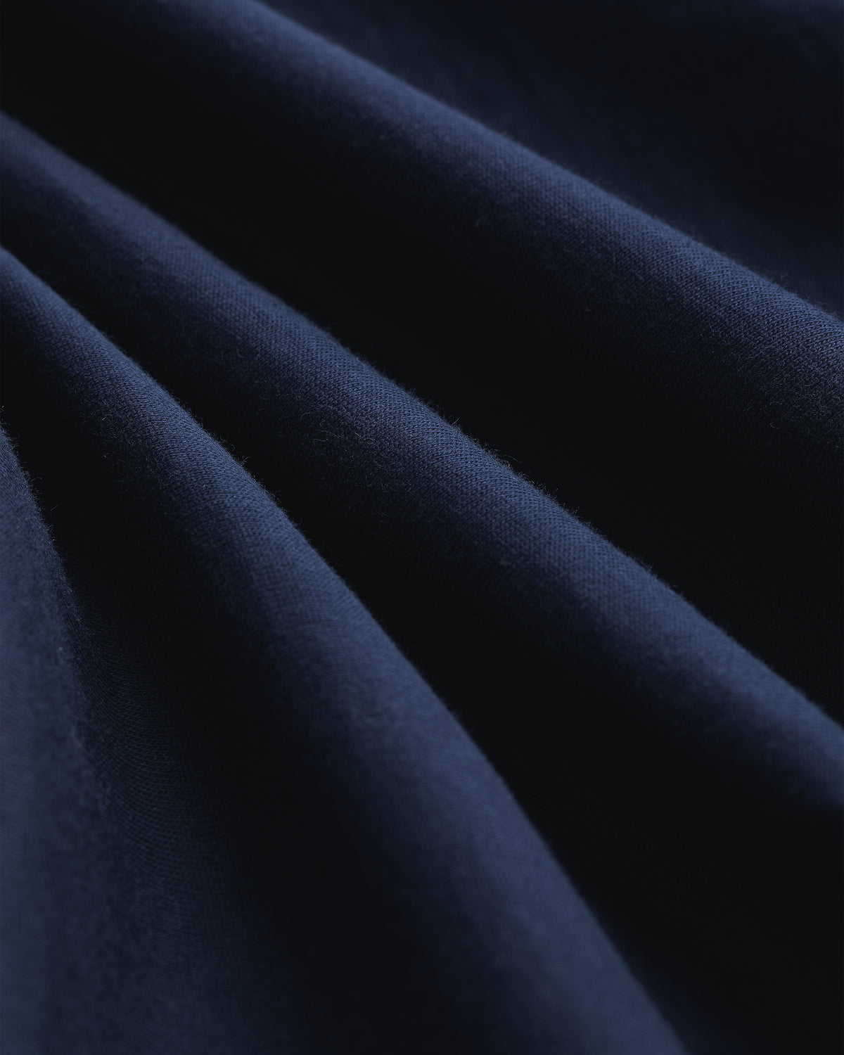 Close-up of Multi-Color T-Shirt 3-Pack fabric, showing soft folds, smooth texture, and drape.