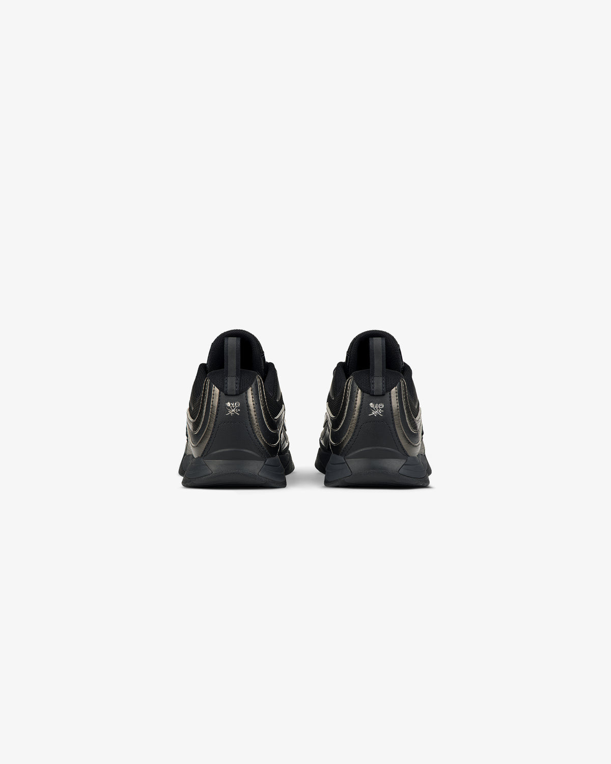 Rear view of ALD / New Balance RC56 black athletic shoes with metallic gold accents on a plain white background.