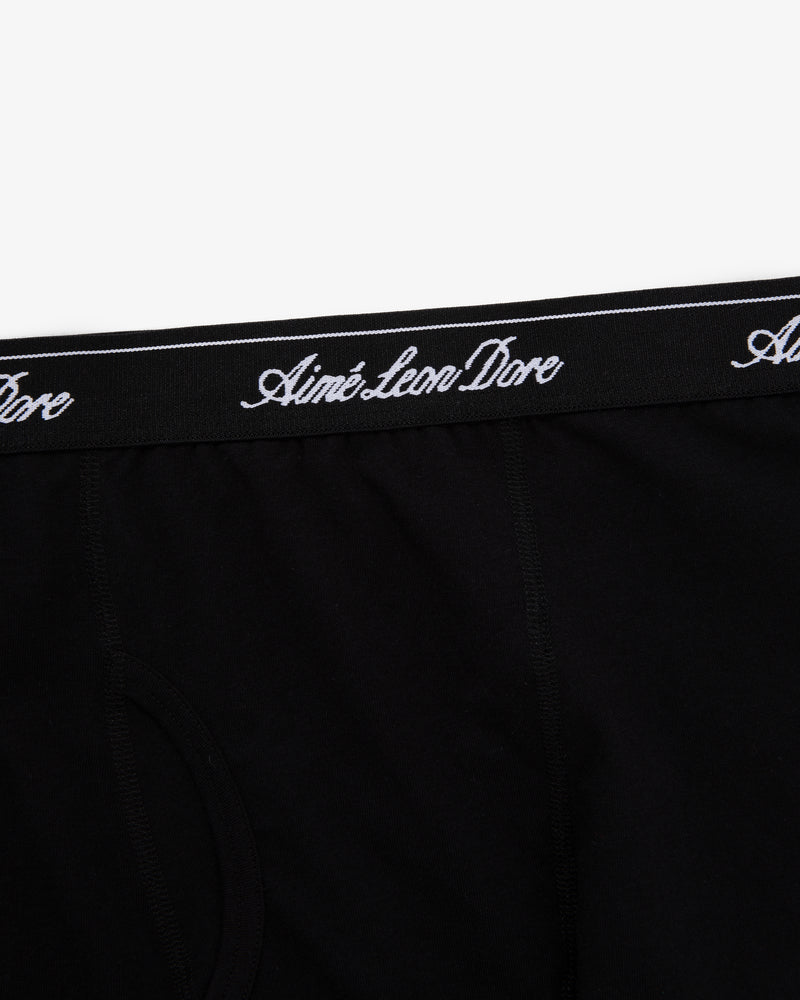 Close-up of black Boxer Brief 3-Pack with Aimé Leon Dore in white script on the waistband.