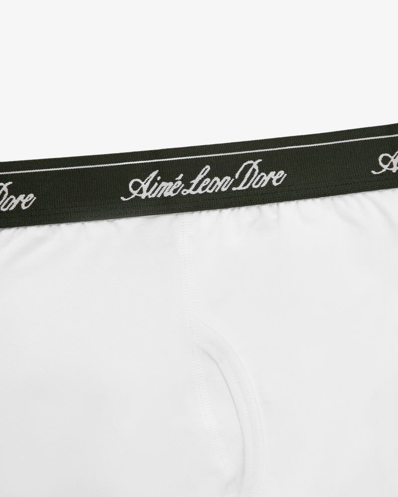 Close-up of white Boxer Brief 3-Pack with a black waistband featuring Aimé Leon Dore in white script.