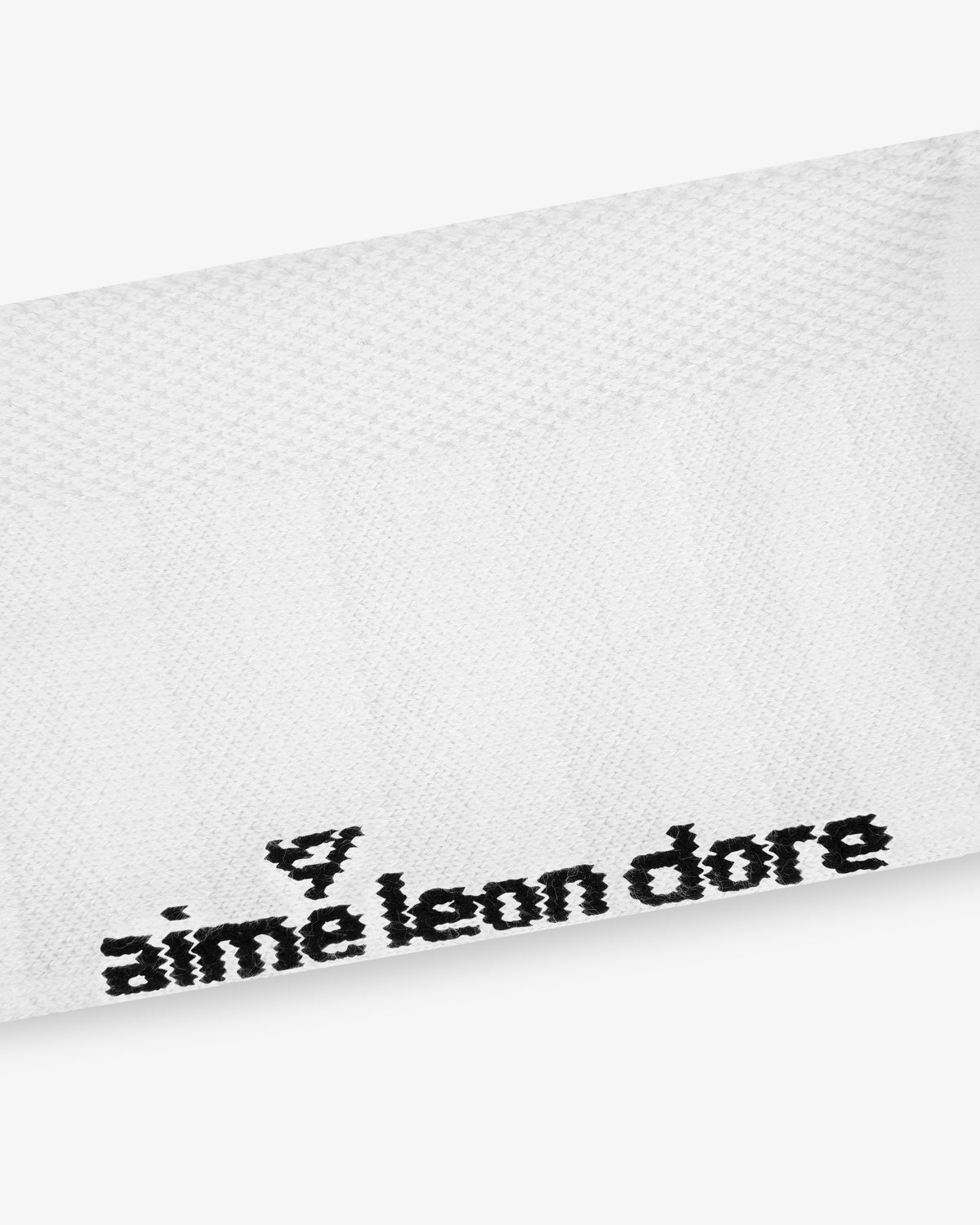White textured ALD Golf Performance Ankle Sock with black "Aime Leon Dore" text and small embroidered logo in one corner.