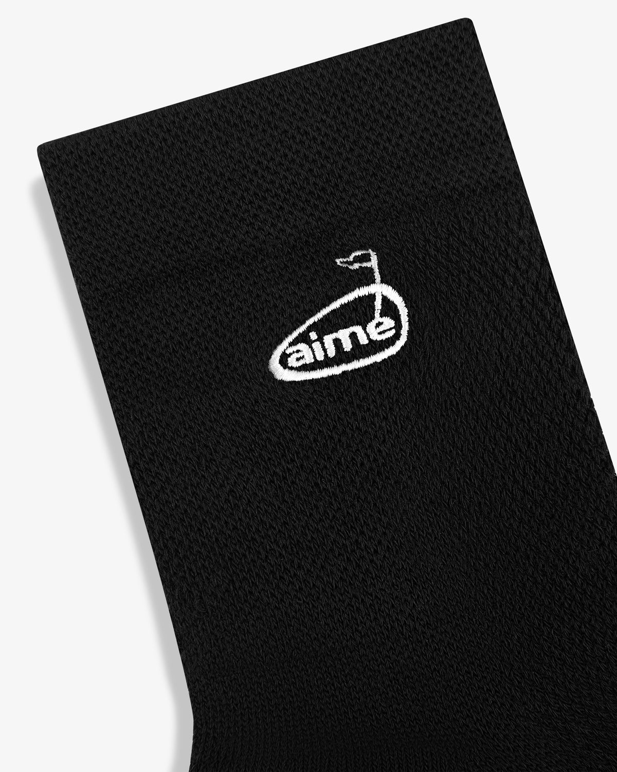 ALD Golf Performance Ankle Sock in black with white aime logo and small flag design, shown on a white background.