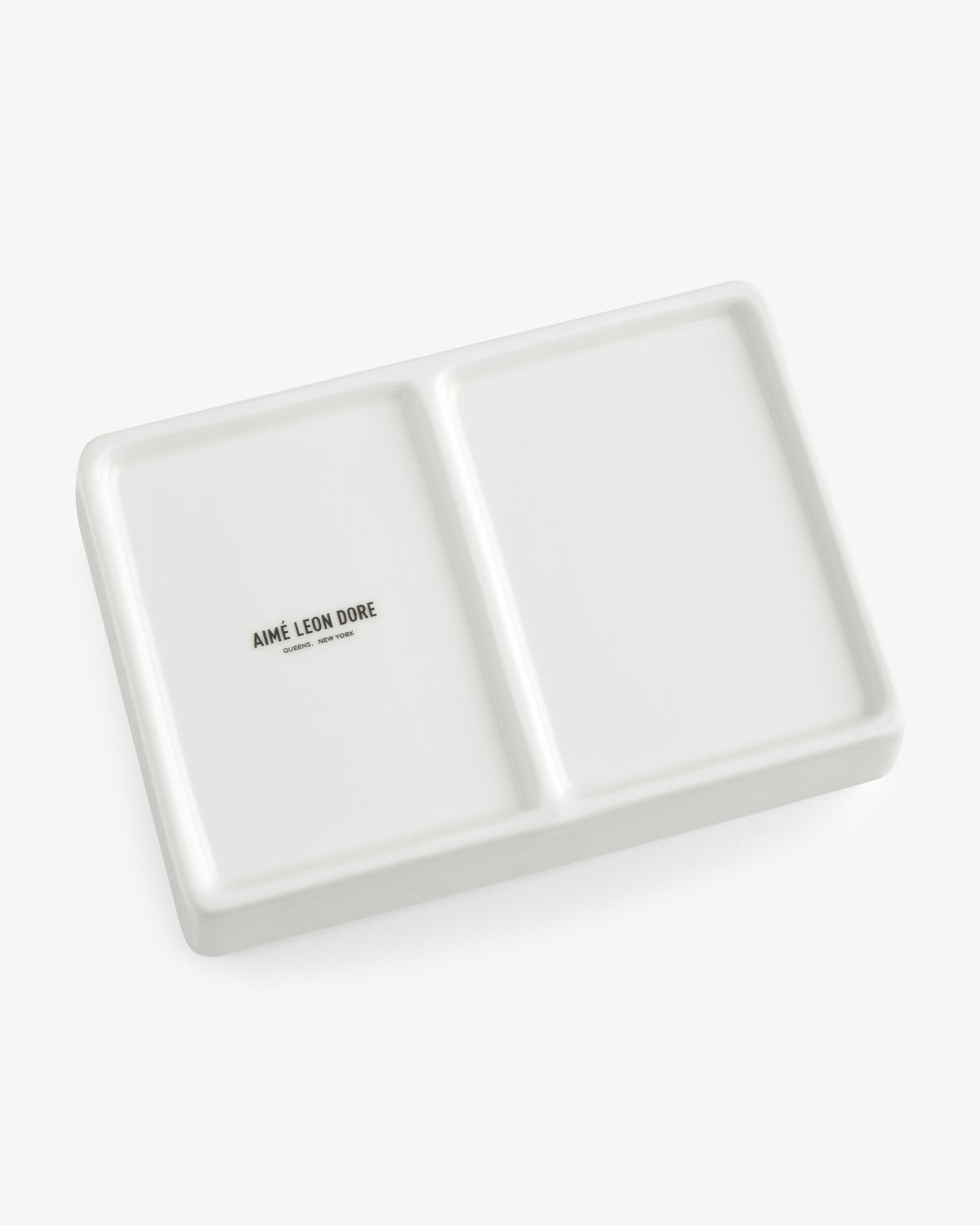 Mulberry Catchall Box: rectangular white ceramic tray with two sections and AIMÉ LEON DORE in one compartment.