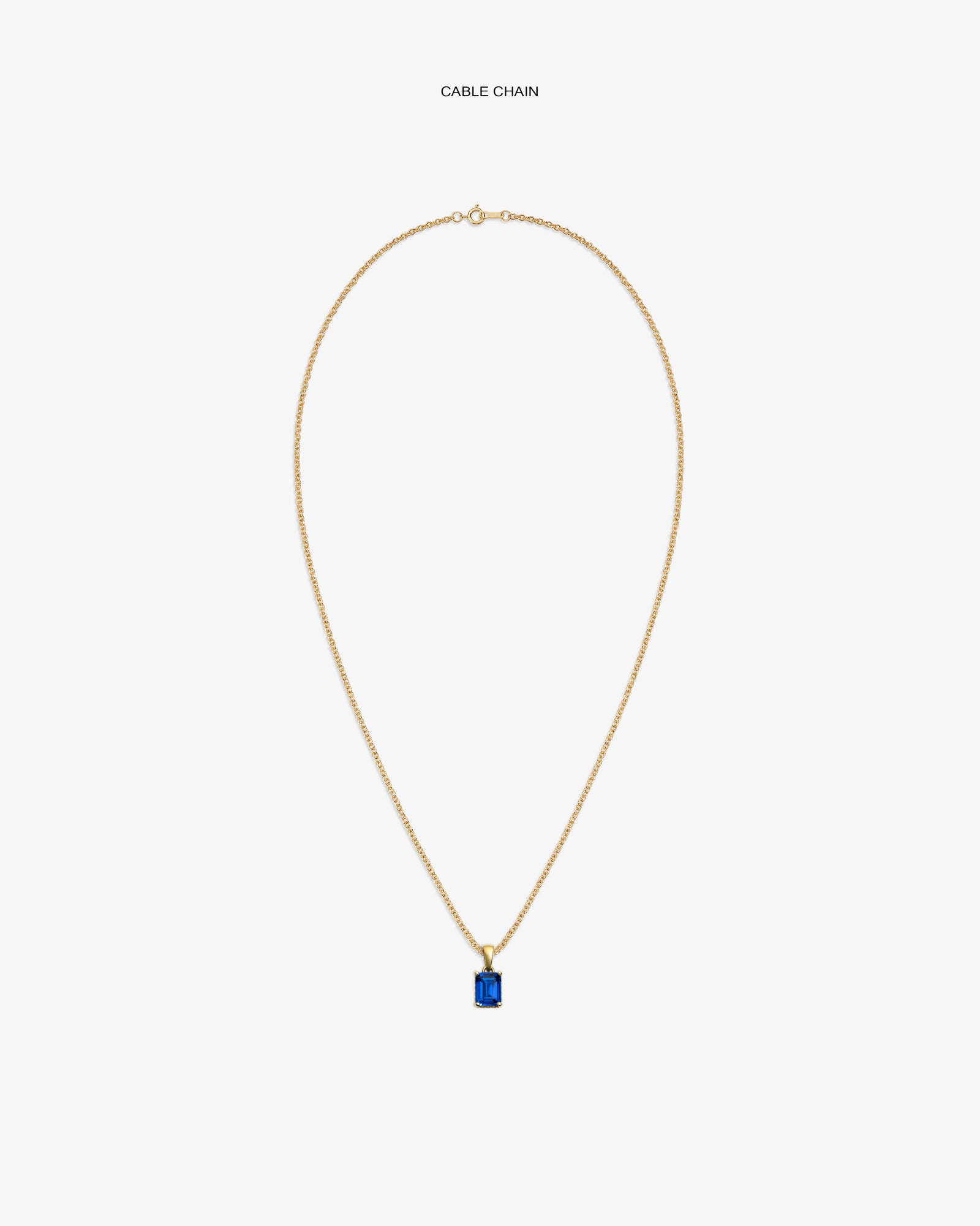 14Kt Gold Gemstone Pendant with a blue stone on a cable chain, shown against a white background.
