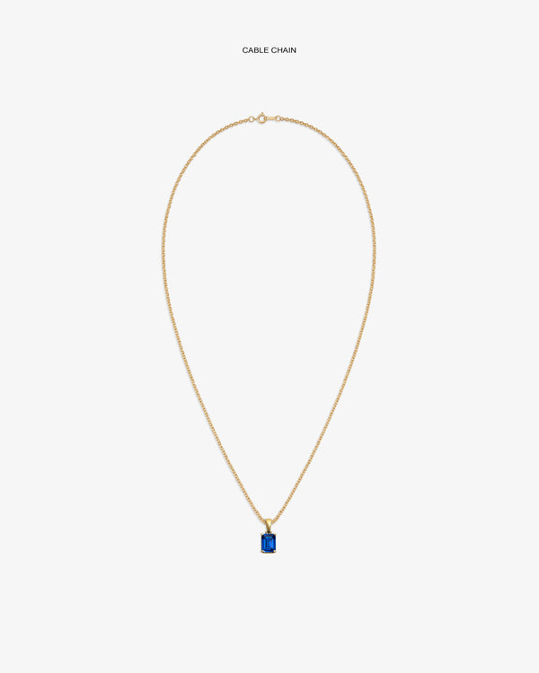 14Kt Gold Gemstone Pendant with a blue stone on a cable chain, shown against a white background.