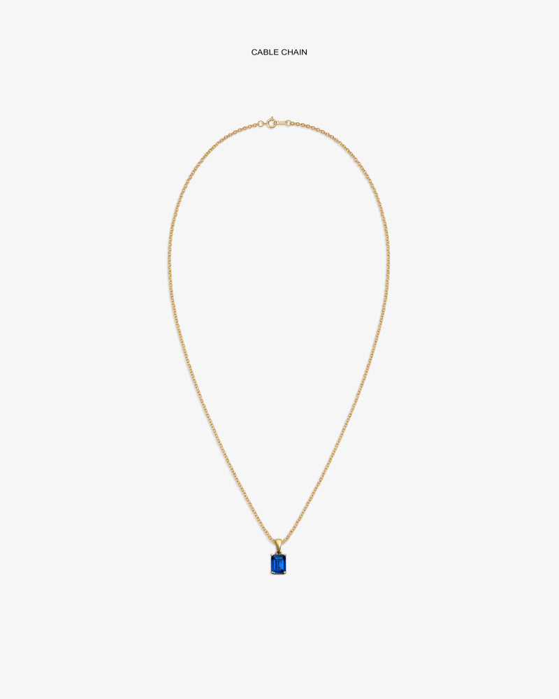 14Kt Gold Gemstone Pendant with a blue stone on a cable chain, shown against a white background.