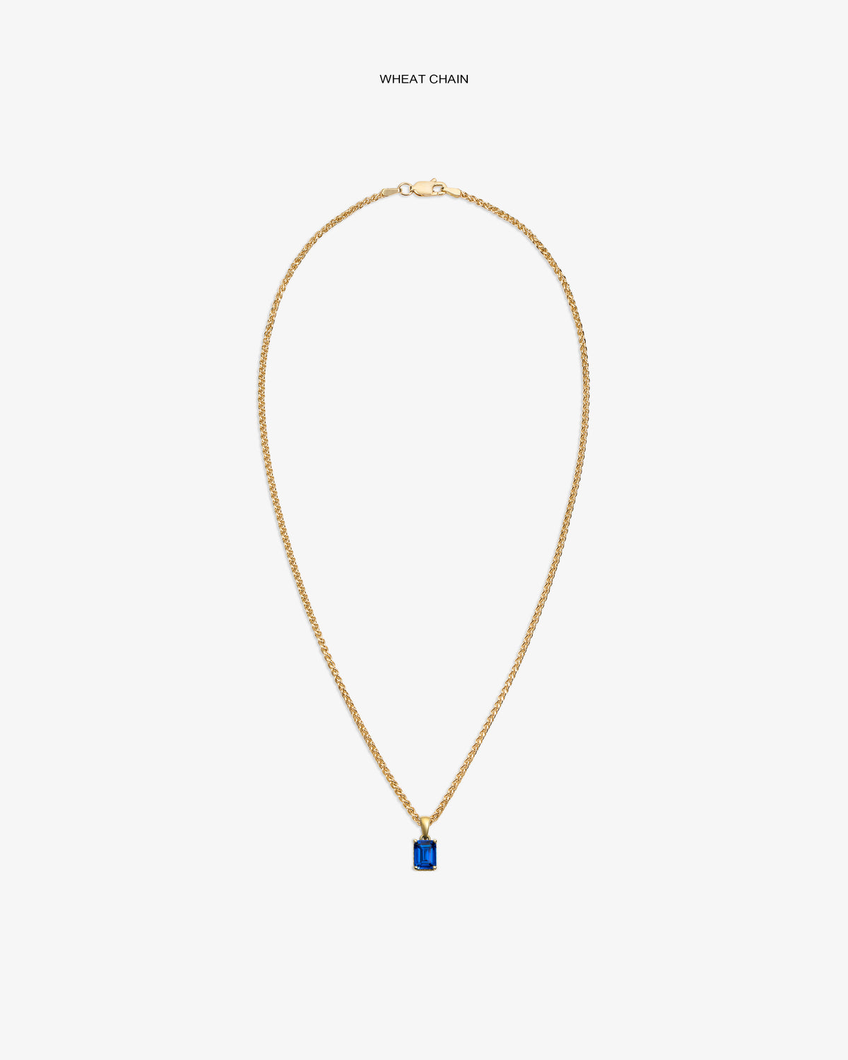 14Kt Gold Gemstone Pendant featuring a rectangular blue stone on a wheat chain, shown against a white background.