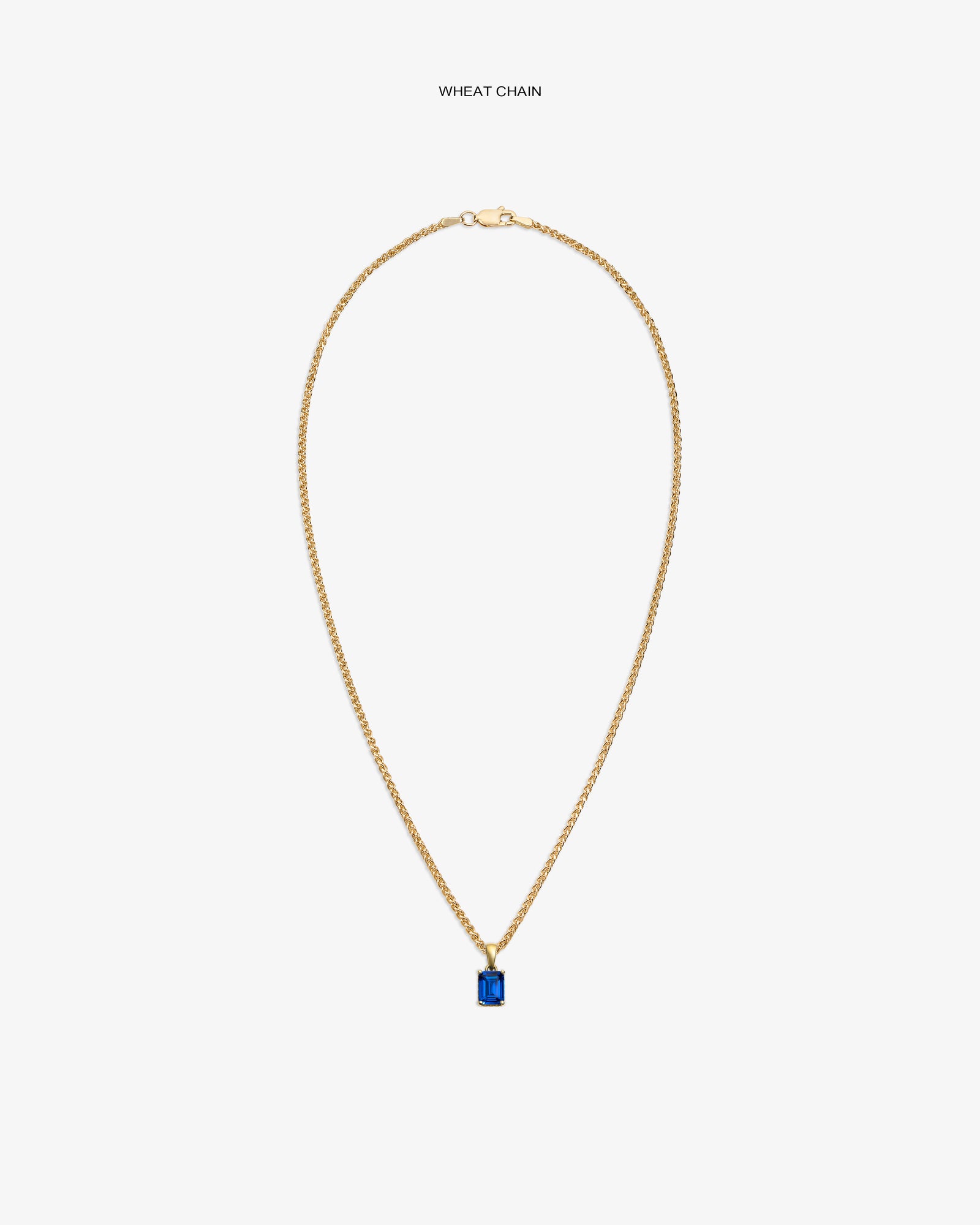 14Kt Gold Gemstone Pendant featuring a rectangular blue stone on a wheat chain, shown against a white background.