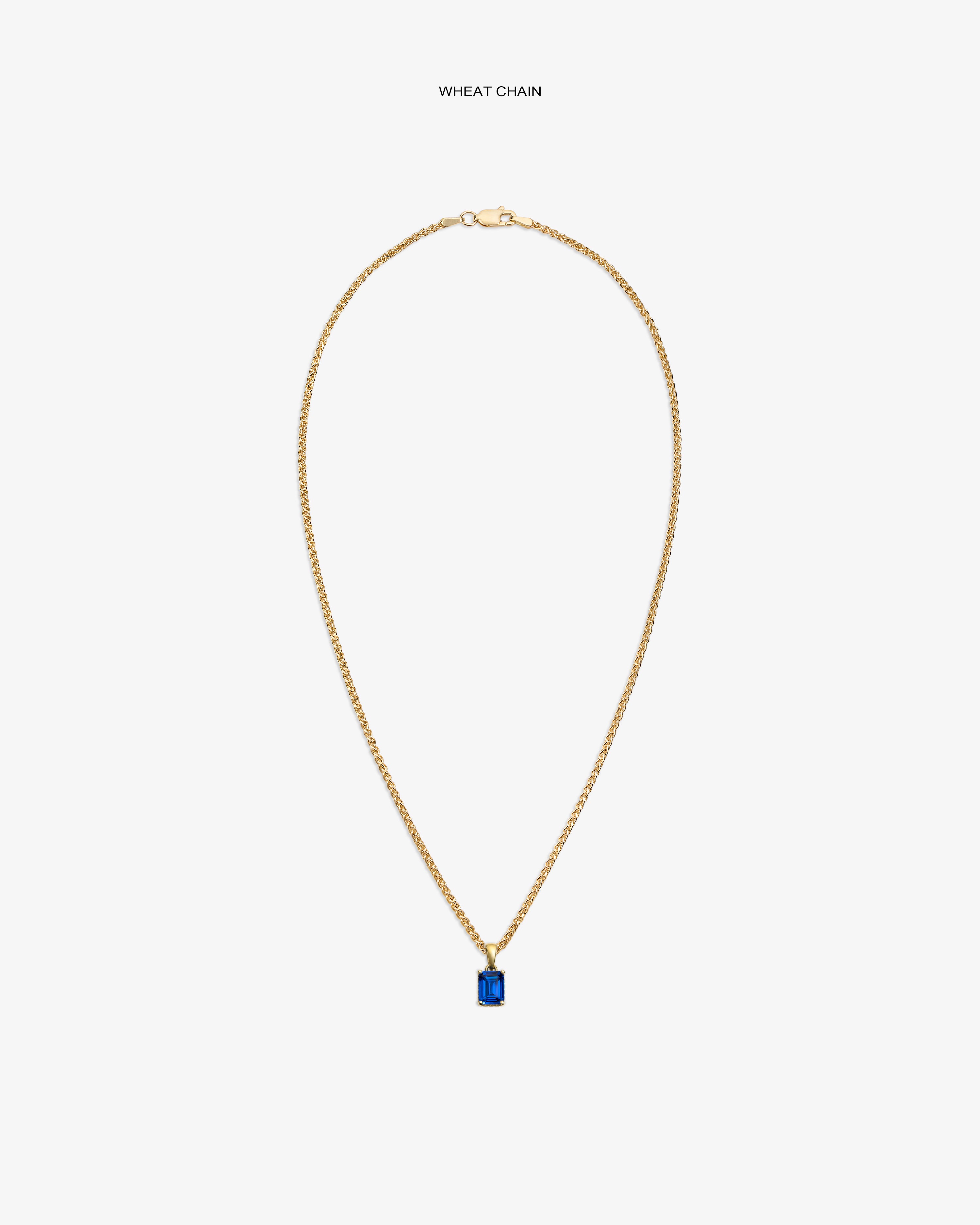 14Kt Gold Gemstone Pendant featuring a rectangular blue stone on a wheat chain, shown against a white background.