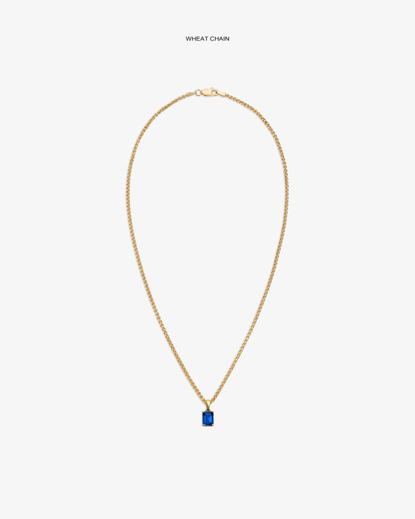 14Kt Gold Gemstone Pendant featuring a rectangular blue stone on a wheat chain, shown against a white background.
