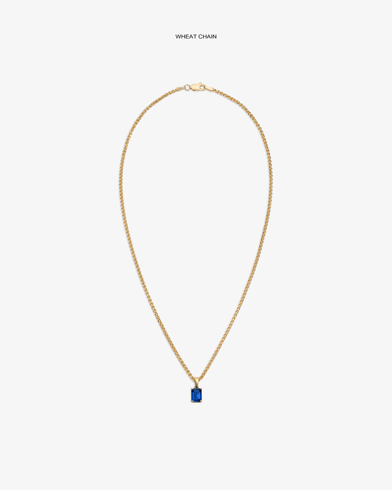 14Kt Gold Gemstone Pendant featuring a rectangular blue stone on a wheat chain, shown against a white background.