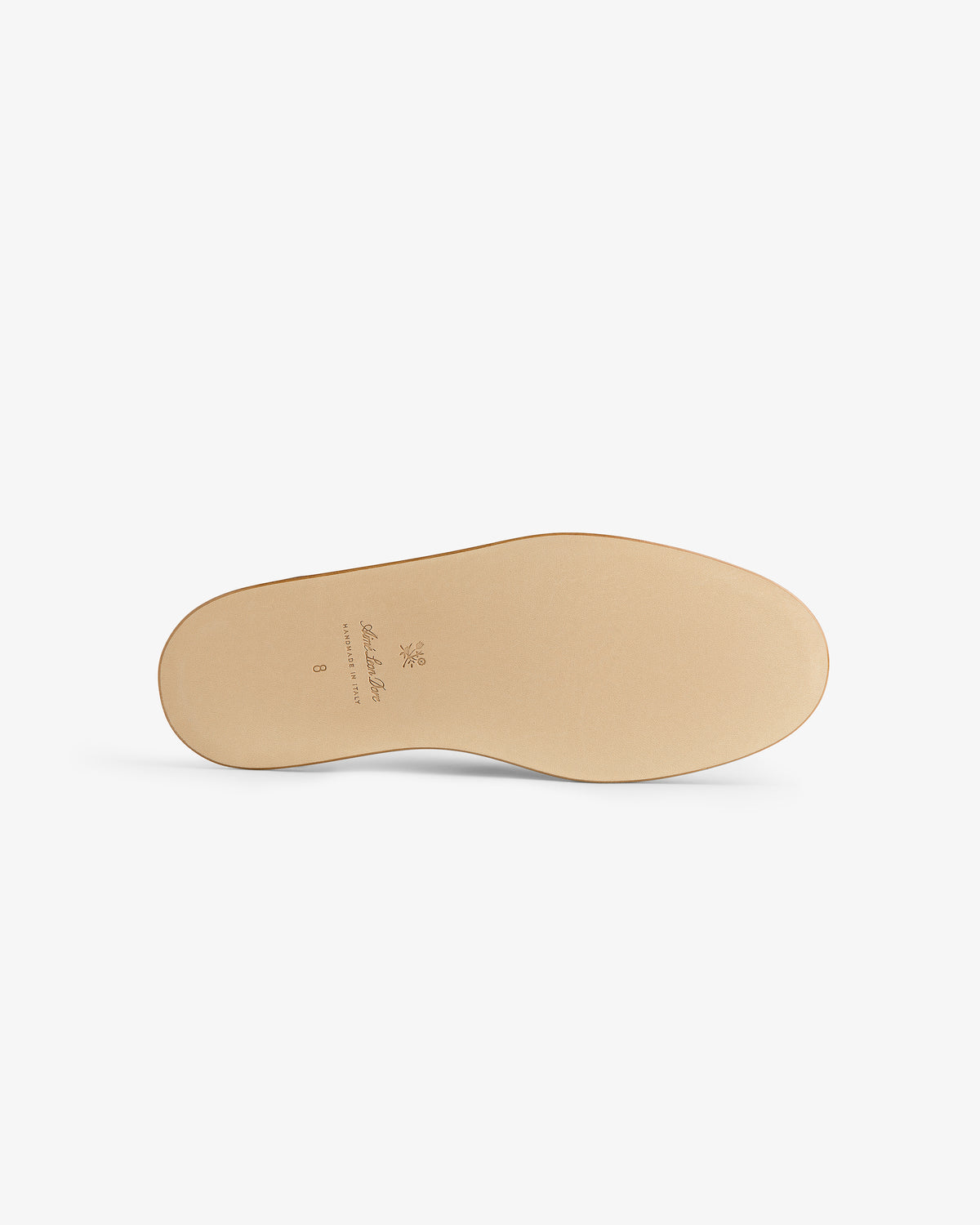 The image shows the beige sole of the Nubuck Travel Slipper, viewed from the bottom against a white background.
