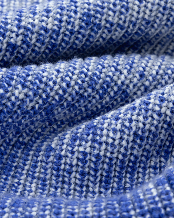 Close-up of Kalloni Shaker Stitch Sweater in blue and white, showing its textured, wavy knit and tightly woven yarns.
