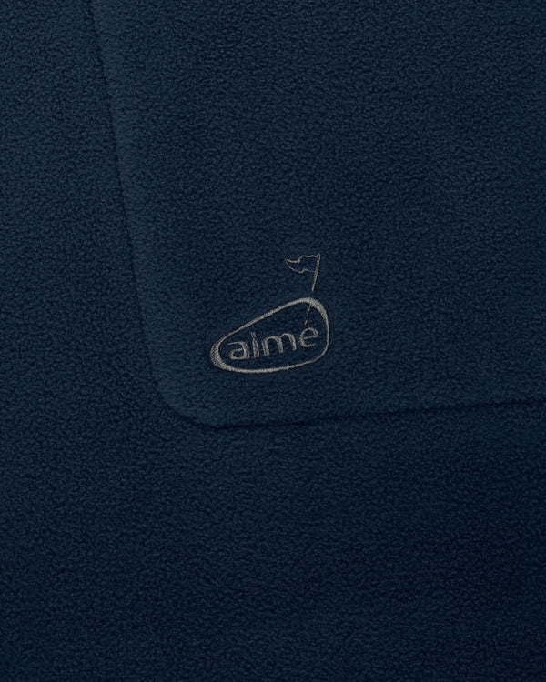 Navy ALD Golf Fleece Vest with a small stitched “aime” logo and flag detail above it.