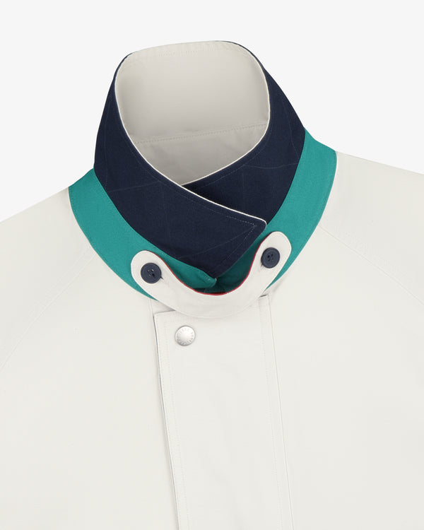 Sailing Jacket: White with high collar, teal/navy trim, and two visible buttons near the neck.