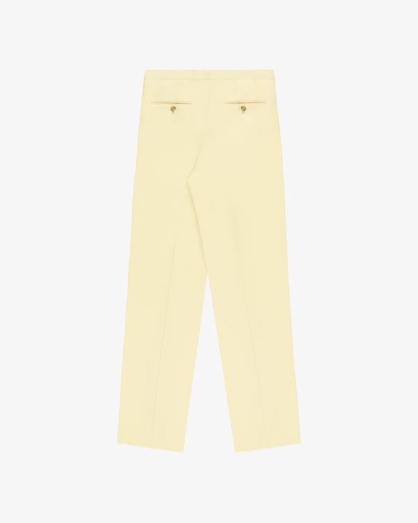 Back of Gabardine Suit Trouser in cream with two buttoned welt pockets, shown on a white background.