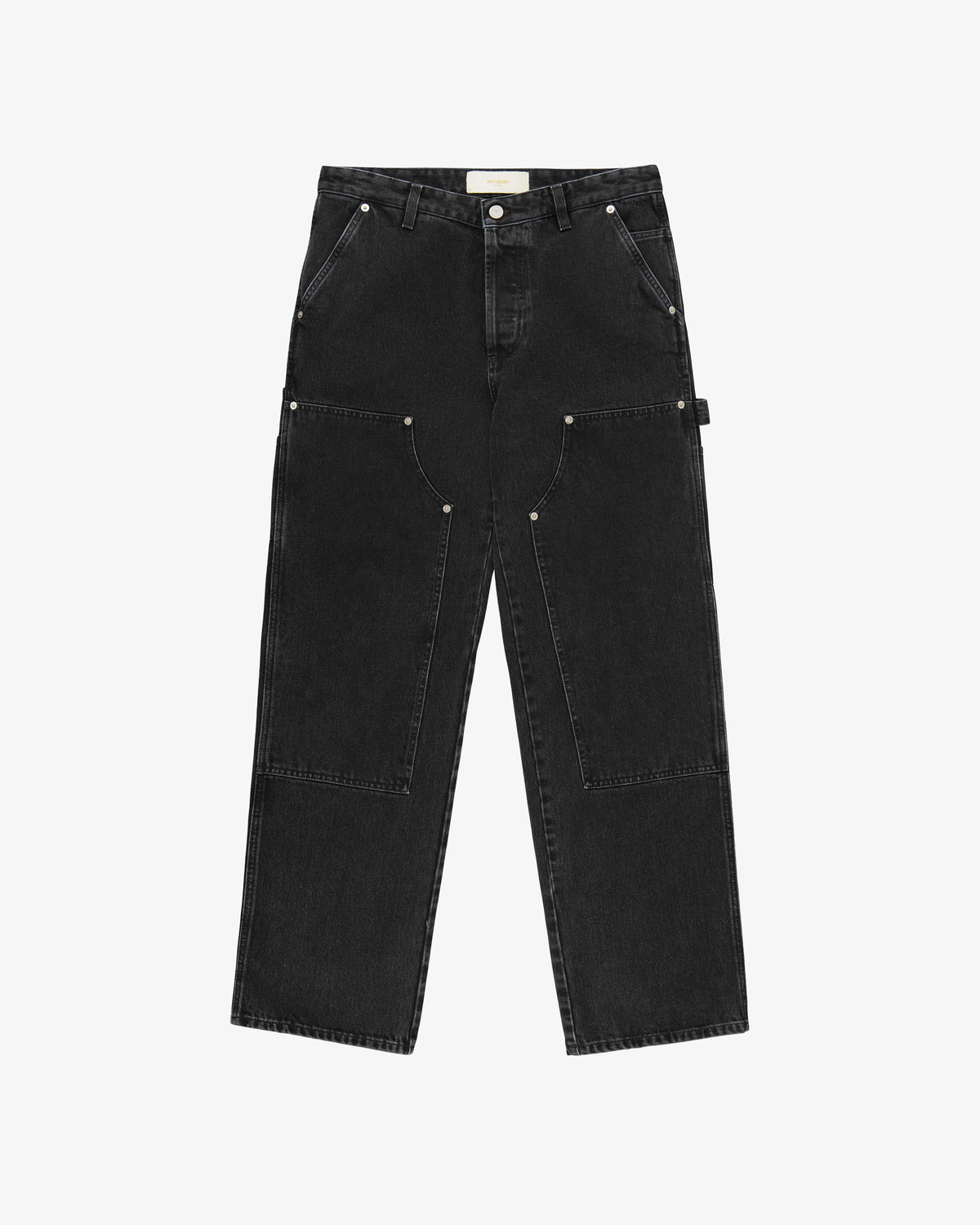 The Denim Carpenter Pant features black straight-leg denim, front patch pockets, silver rivets, and button fly.