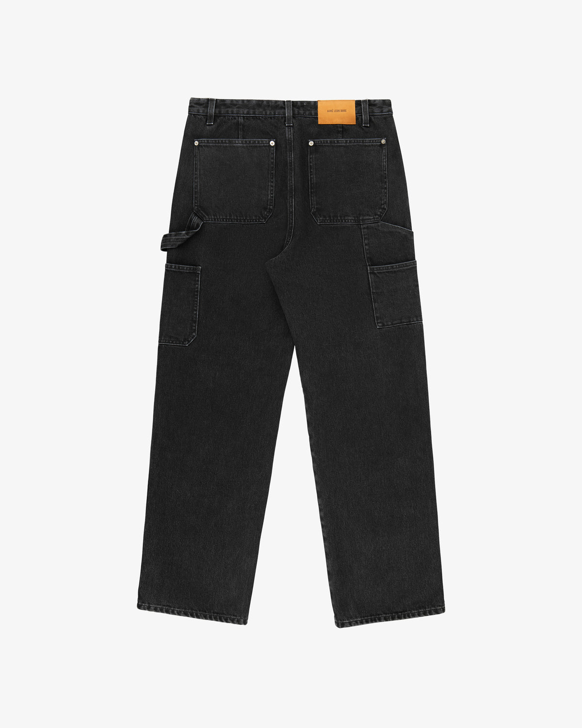 Back view of Denim Carpenter Pant in black with large patch pockets, tool loops, and a tan label on the waistband.