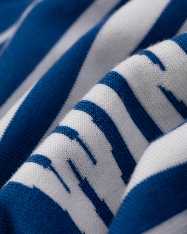 Close-up of WINDSTOPPER® Striped Knit Cycling Jersey by GORE-TEX LABS, highlighting its blue and white textured fabric.