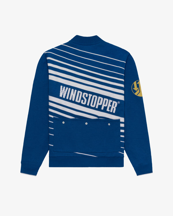WINDSTOPPER® Striped Knit Cycling Jersey by GORE-TEX LABS: blue with white stripes, yellow patch on left sleeve.
