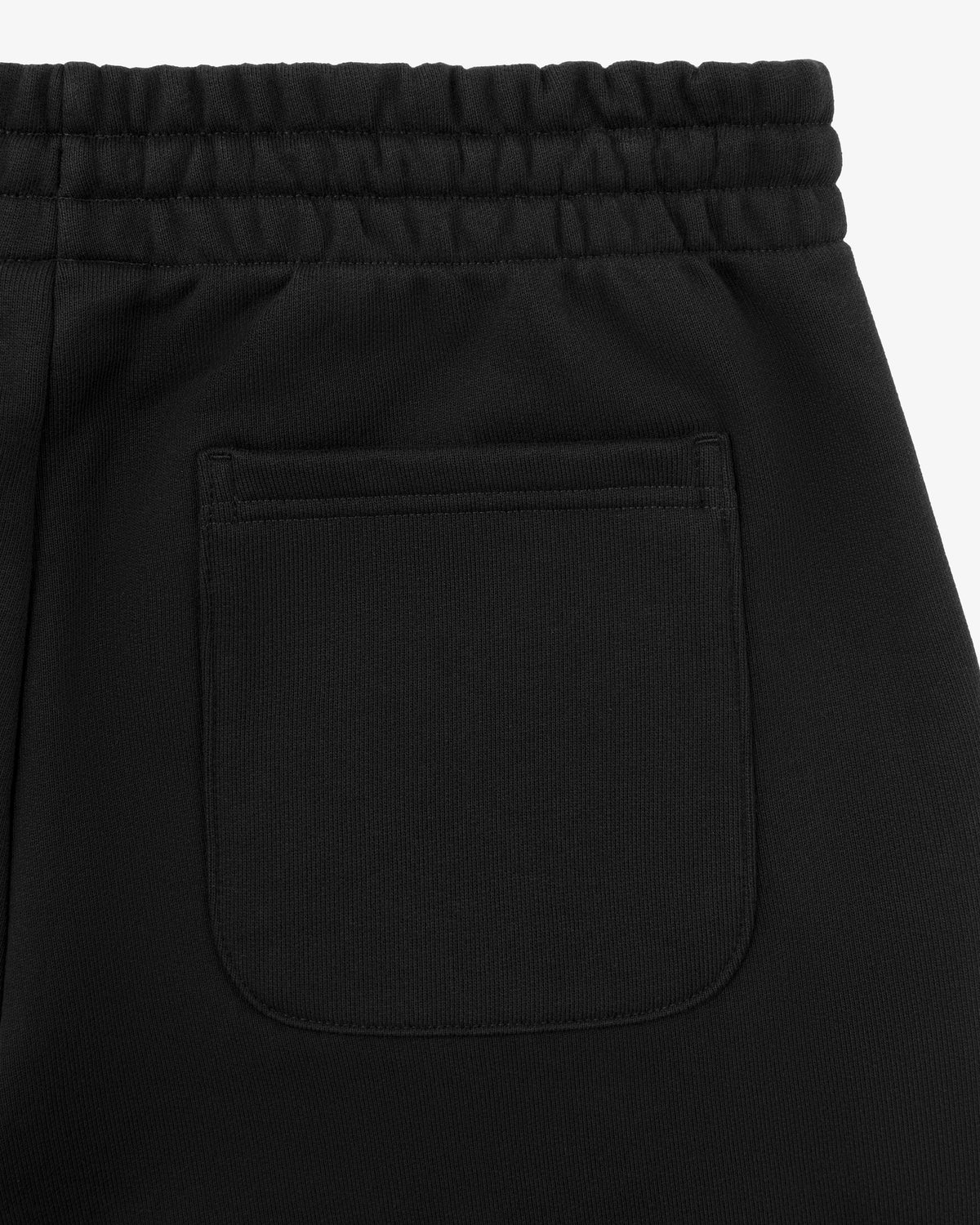 Close-up of the back pocket and elastic waistband on Tonal Logo Sweatpants.