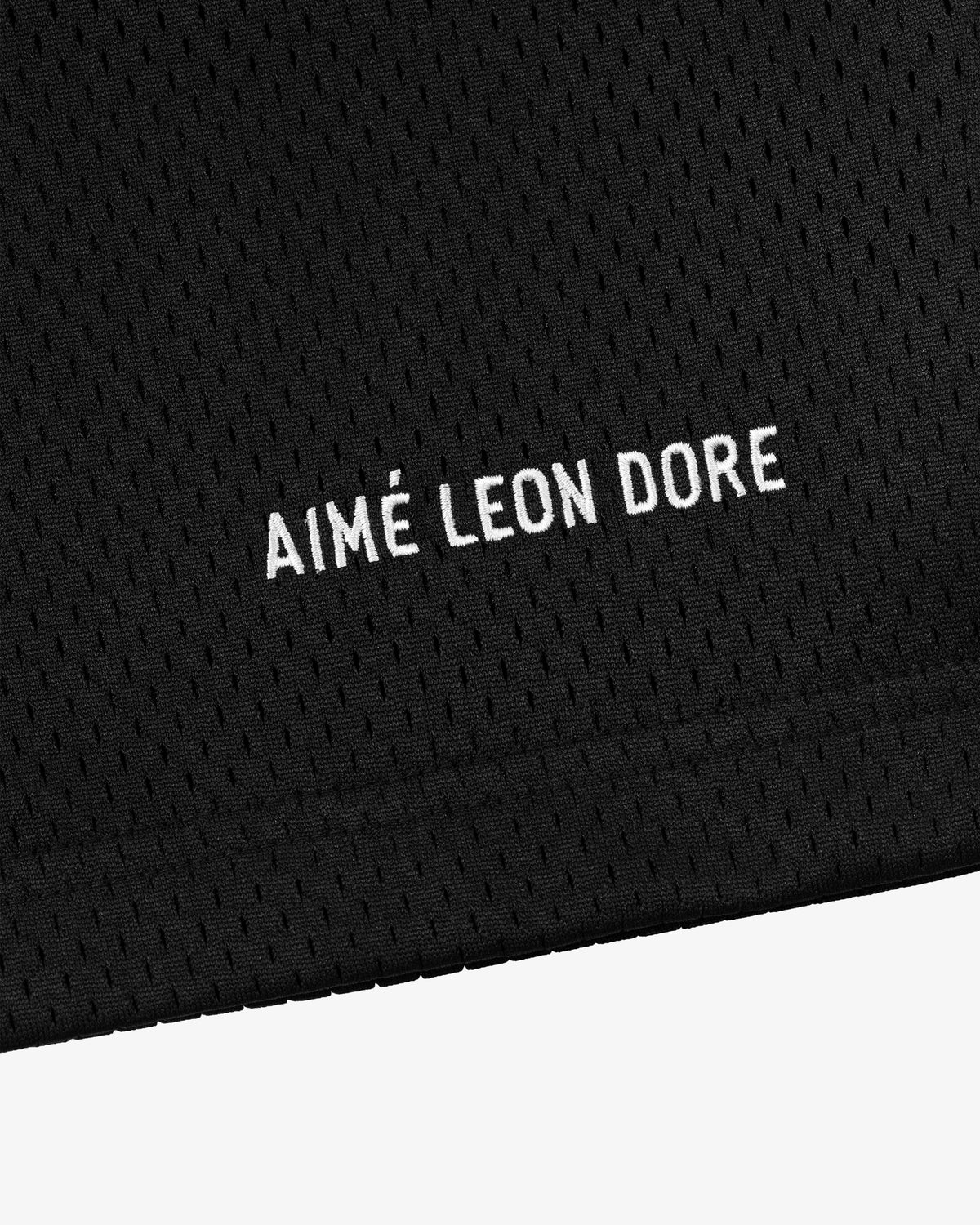 Black mesh Logo Gym Short with AIMÉ LEON DORE embroidered in white near the bottom edge.