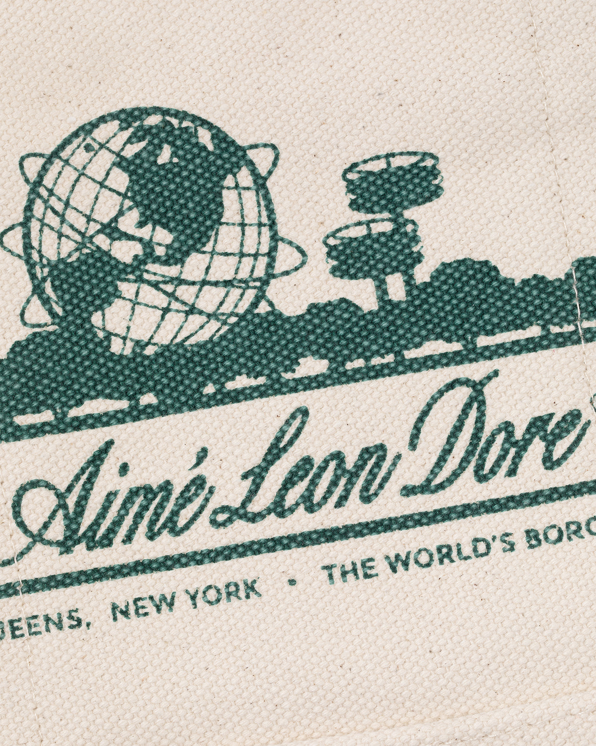 Green globe and structures graphic with Aimé Leon Dore text on Mini Unisphere Tote Bag, Queens NY, The World's Borough.