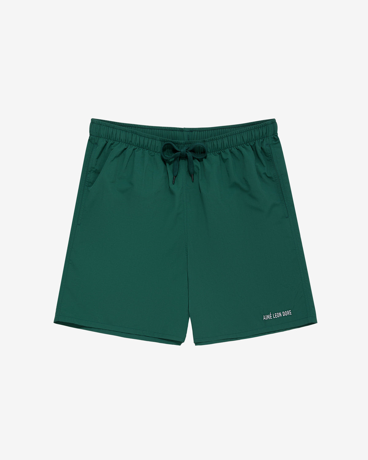 Core Nylon Short with elastic waistband, drawstring, side pockets, and small white logo on front left leg.