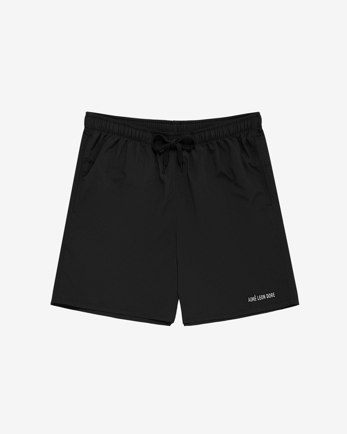 Core Nylon Short swim shorts with side pockets and AIME LEON DORE text on the lower left leg, shown on white.