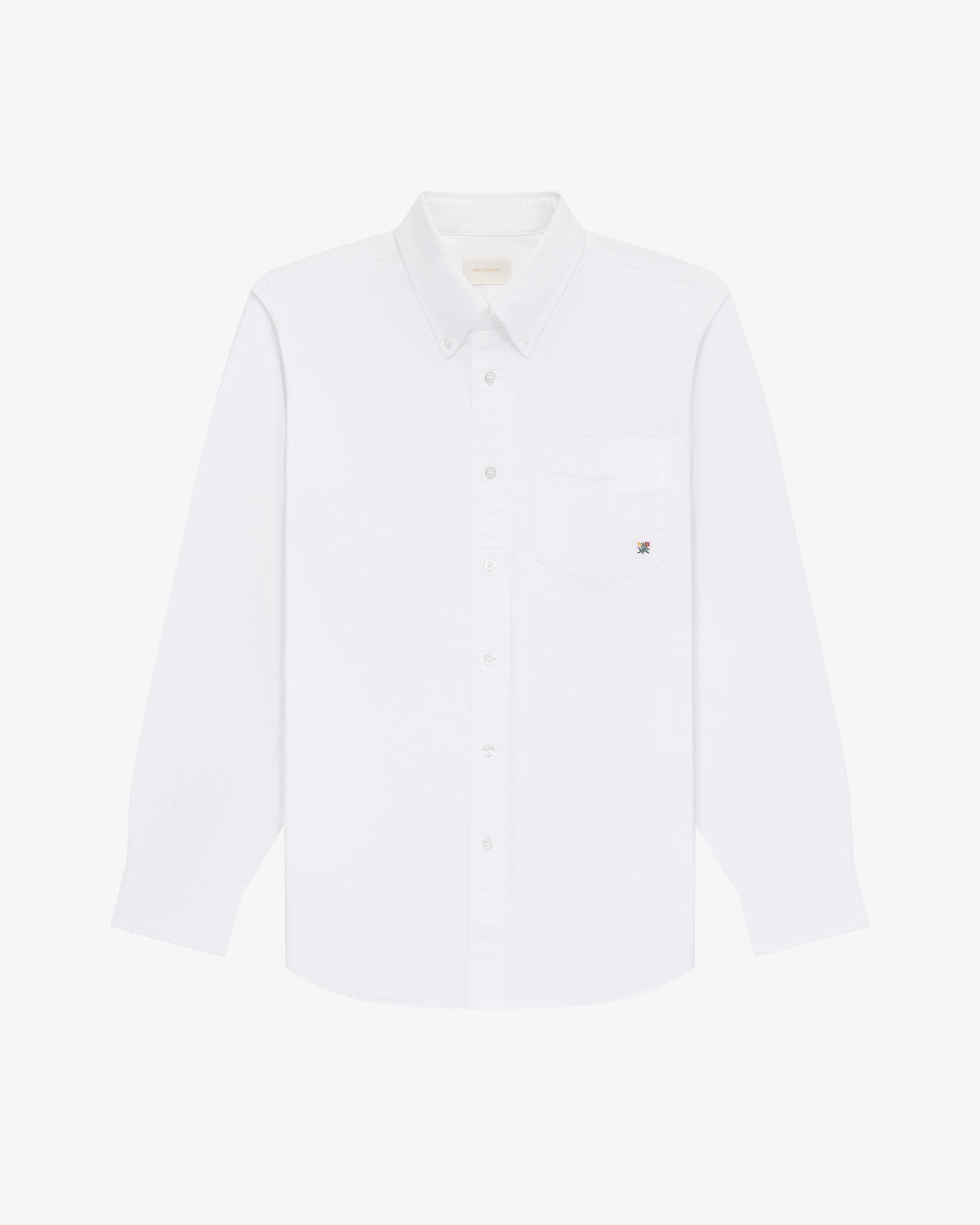Crest Oxford Shirt: white, long-sleeved, button-down with single chest pocket on plain white background.