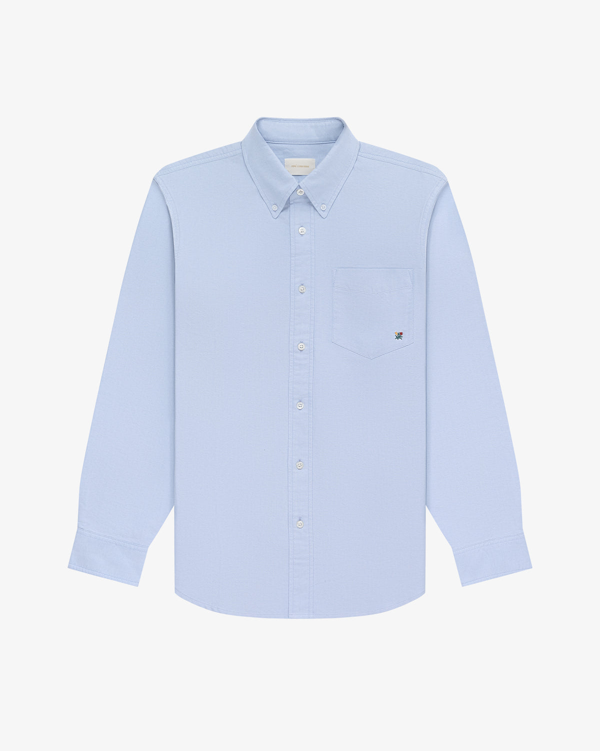Light blue Crest Oxford Shirt with long sleeves, chest pocket, and button-down collar on a white background.