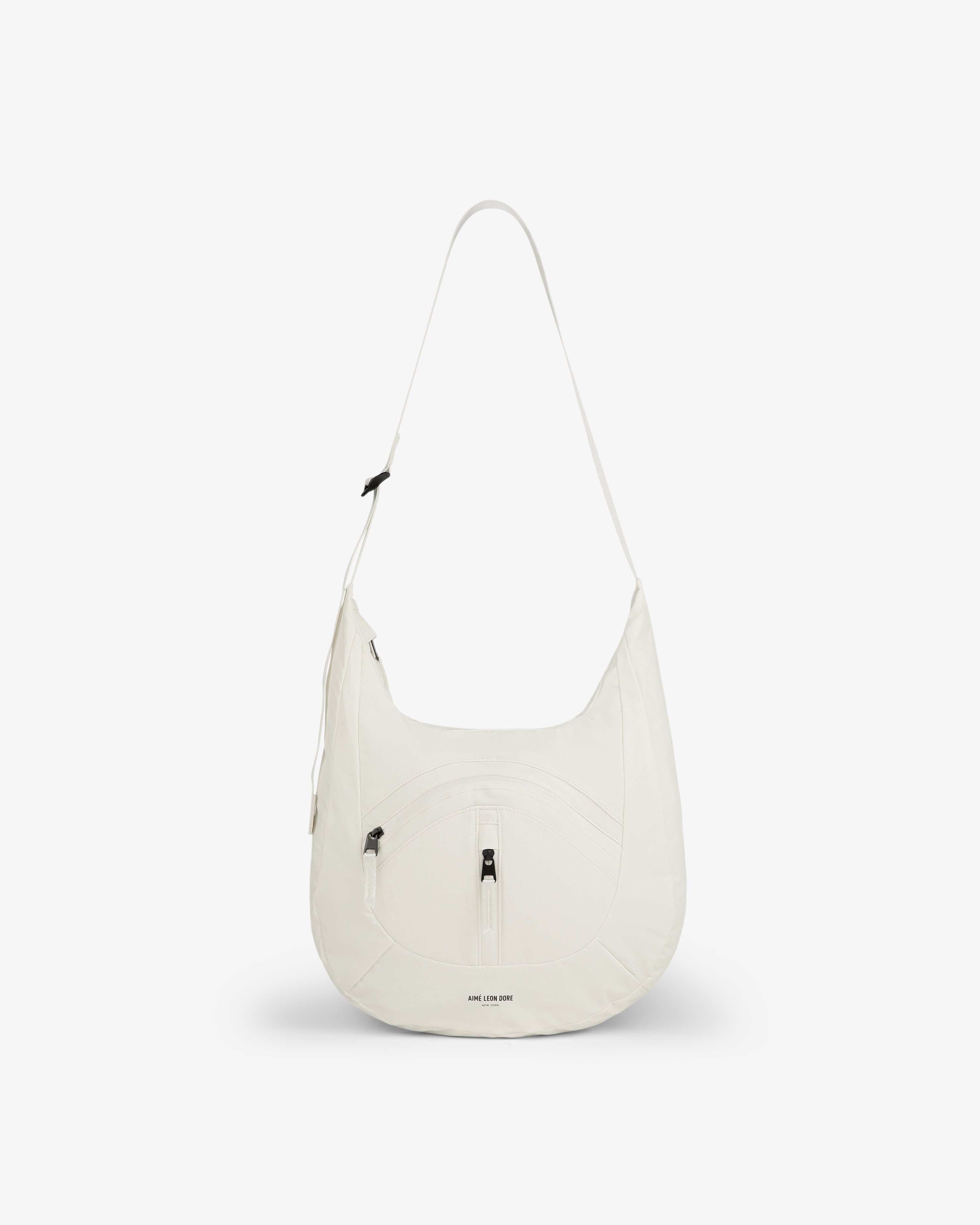 Nylon Messenger Bag in white with a front zipper pocket and long strap, shown on a plain white background.