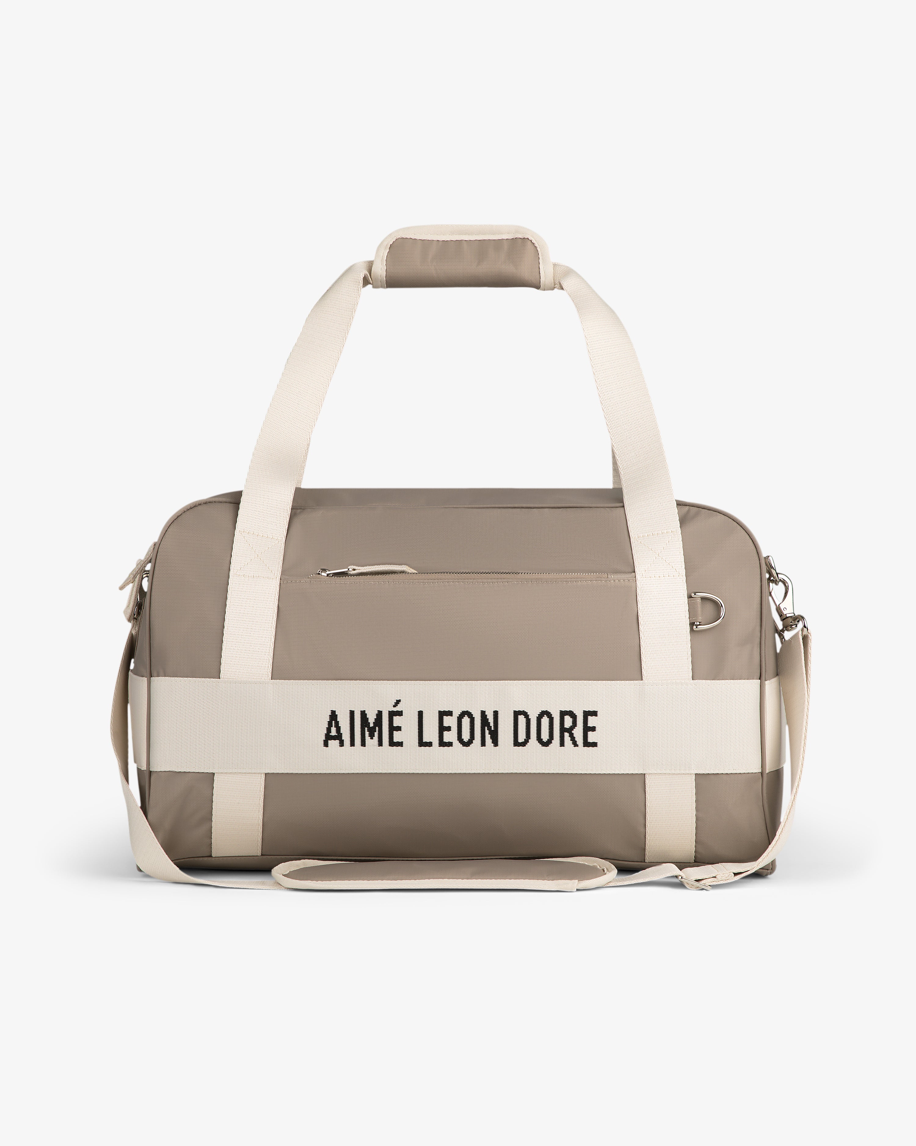 Nylon Duffle Bag in taupe with cream handles and strap, AIMÉ LEON DORE text on front.