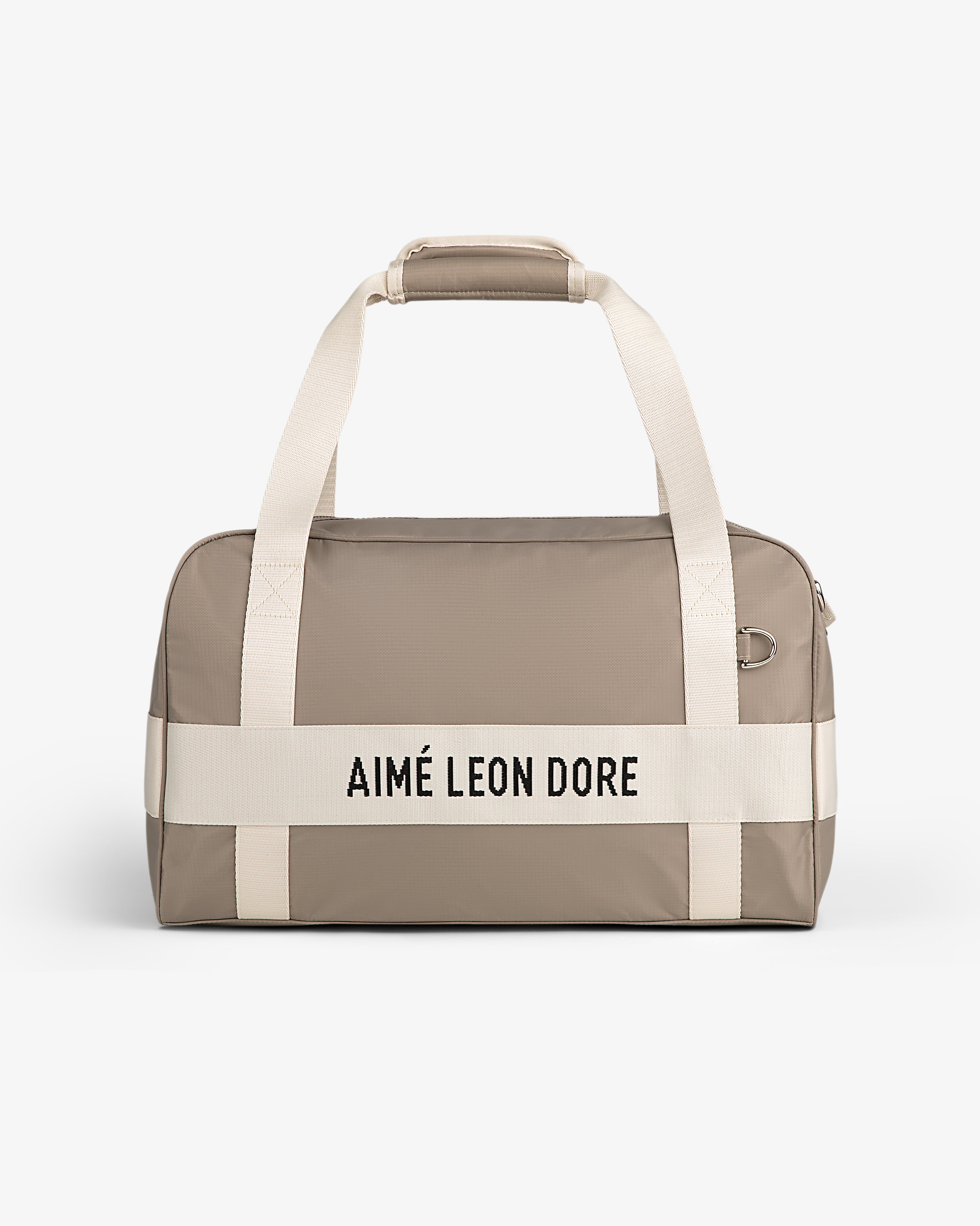 Nylon Duffle Bag in taupe with white handles and AIMÉ LEON DORE text, shown on a white background.