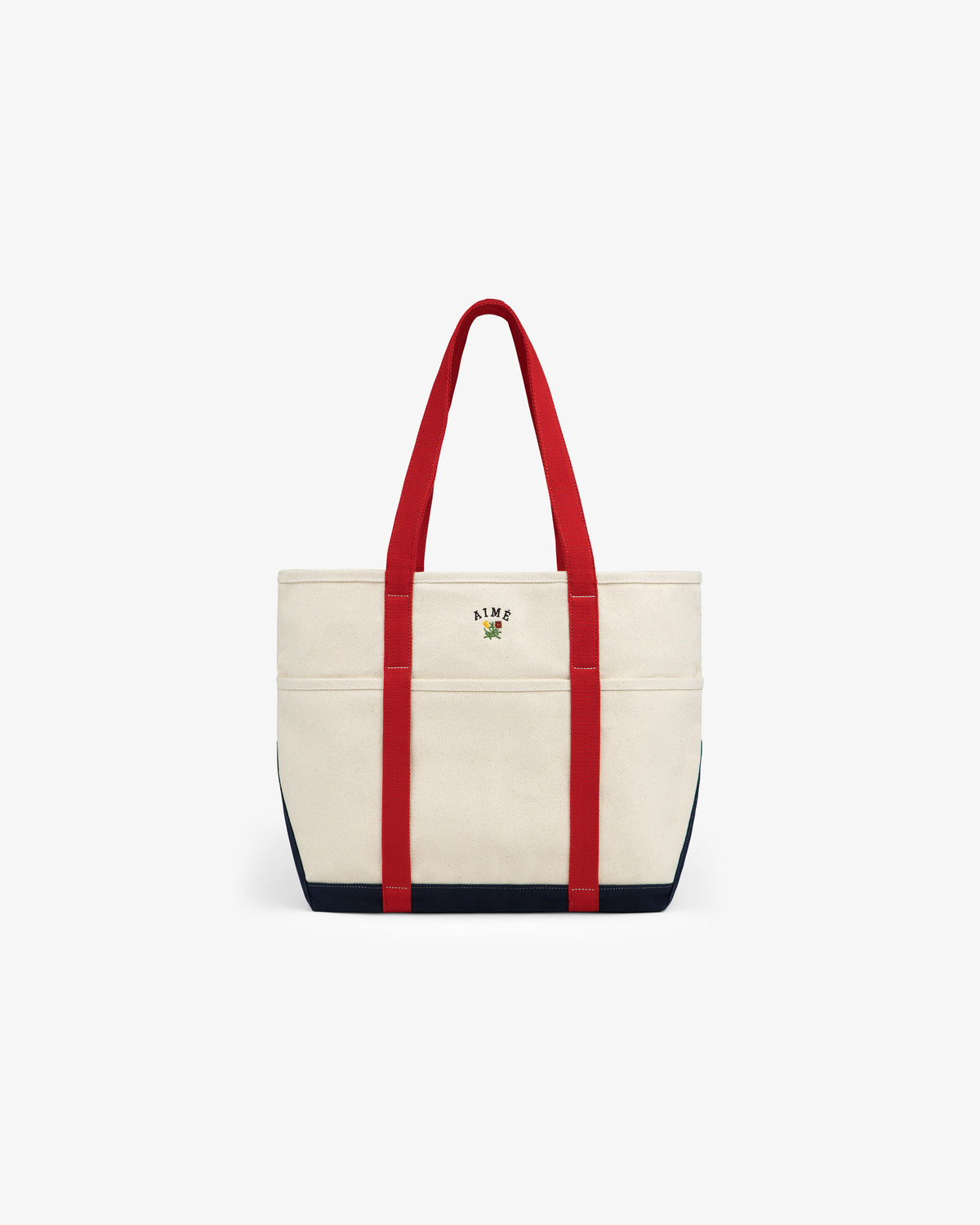 Large Crest Contrast Tote Bag: Beige canvas with red handles, navy blue base, and small front embroidery.