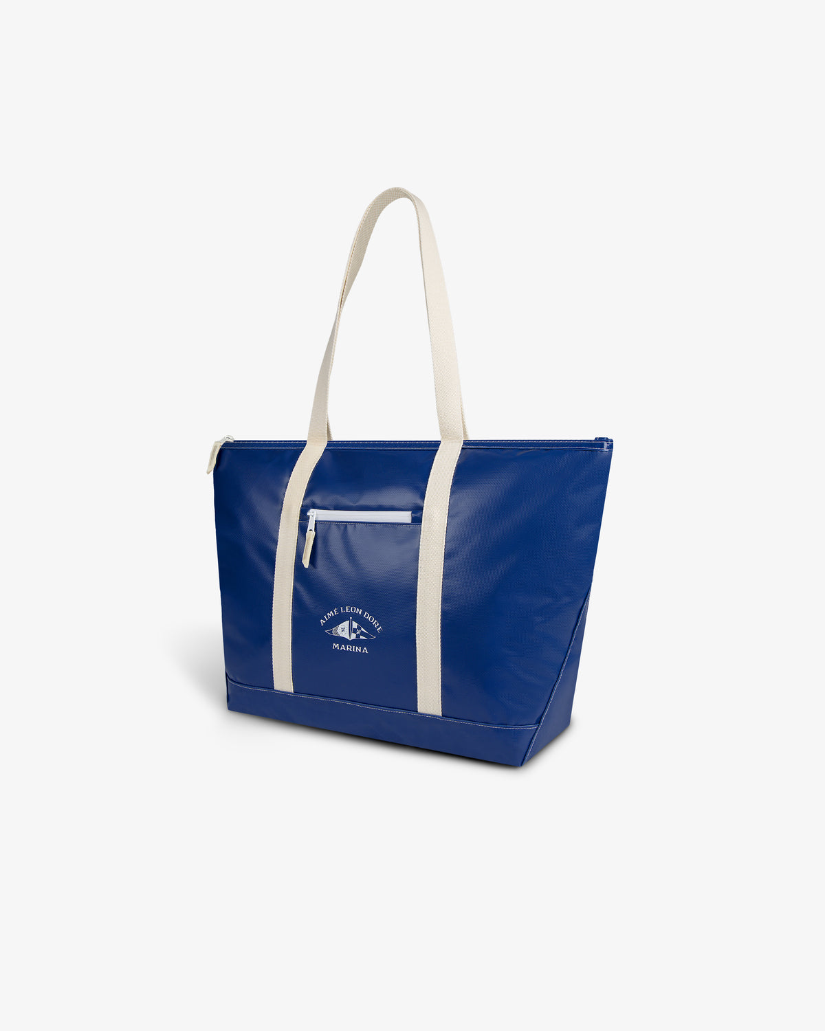 The Carryall Marina Tote is large, blue with white handles, a white zipper, and a small front logo against a plain backdrop.