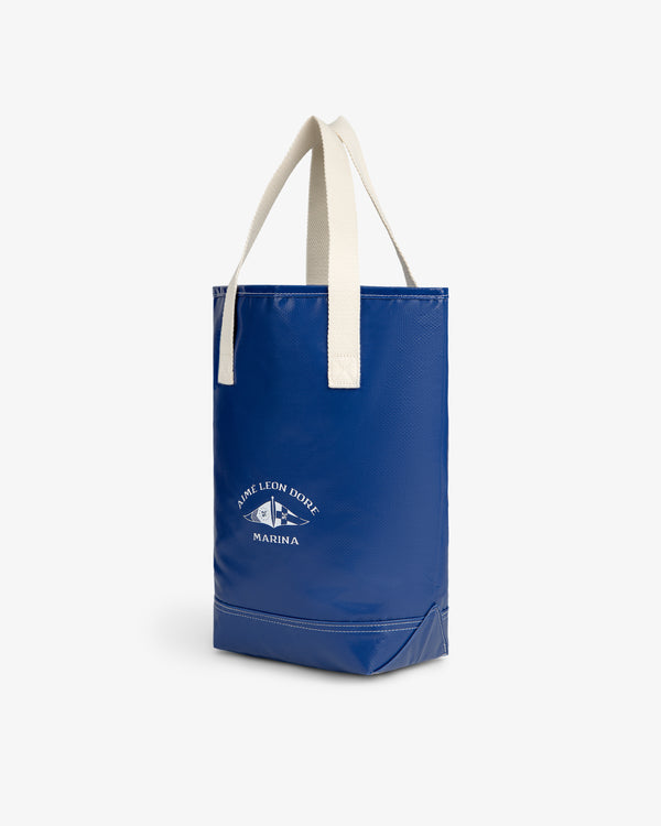 Marina Bottle Tote with cream handles and Aime Leon Dore Marina logo, shown on a white background.